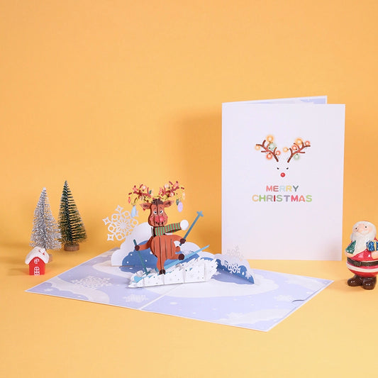 Close up detail of paper cut art reindeer skiing with scarf and ski poles in a 3D holiday card.