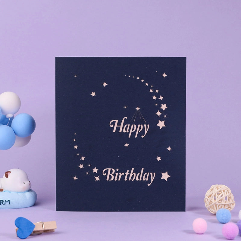 Dark blue card cover with elegant silver star patterns and Happy Birthday typography, ideal gift for teachers or parents.
