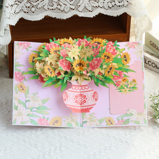 3D pop-up card with pink vase filled with sunflowers lilies and roses on floral background