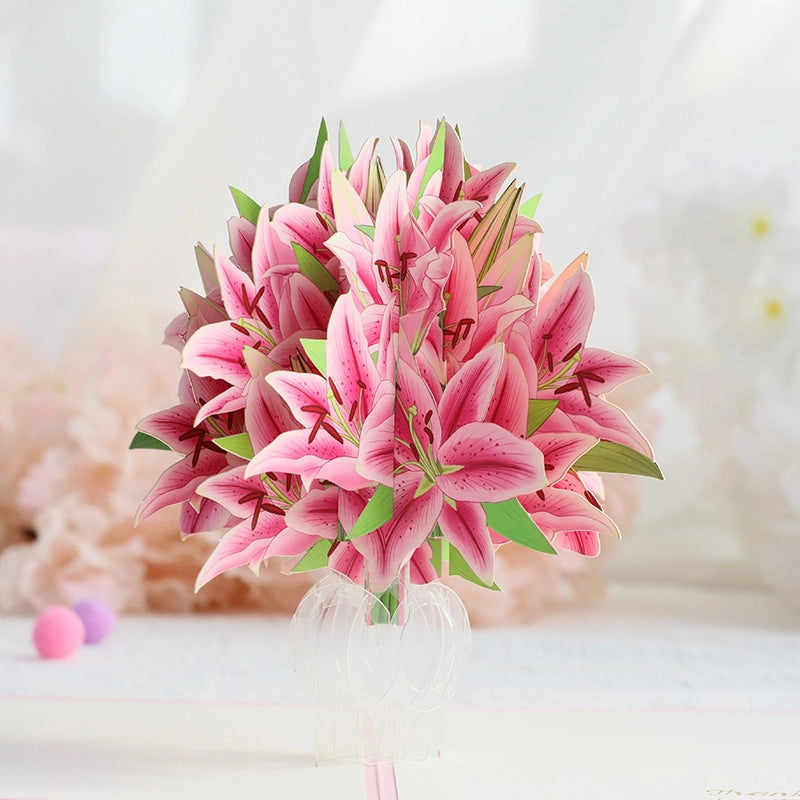 Close-up of intricate pink lily bouquet 3D paper craft standing in a transparent vase structure
