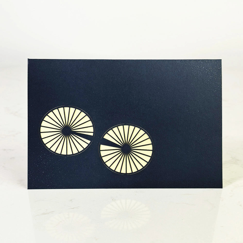 Dark blue vintage bicycle themed greeting card with bicycle wheel design